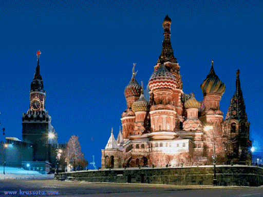 Ночная панорама Храма Василия Блаженного и Спасской башни Кремля в Москве. Величественная подсветка собора и куполов на фоне синего вечернего неба. Анимированная открытка Салют над Красной Площадью Красивый ночной вид на Храм Василия Блаженного и Спасскую башню Московского Кремля на фоне глубокого синего вечернего неба. Величественная архитектура собора с его уникальными разноцветными куполами ярко освещена прожекторами, создавая праздничную и торжественную атмосферу. На переднем плане видна заснеженная площадь и элементы городской инфраструктуры, подчеркивающие масштаб исторического ансамбля Красной площади в Москве