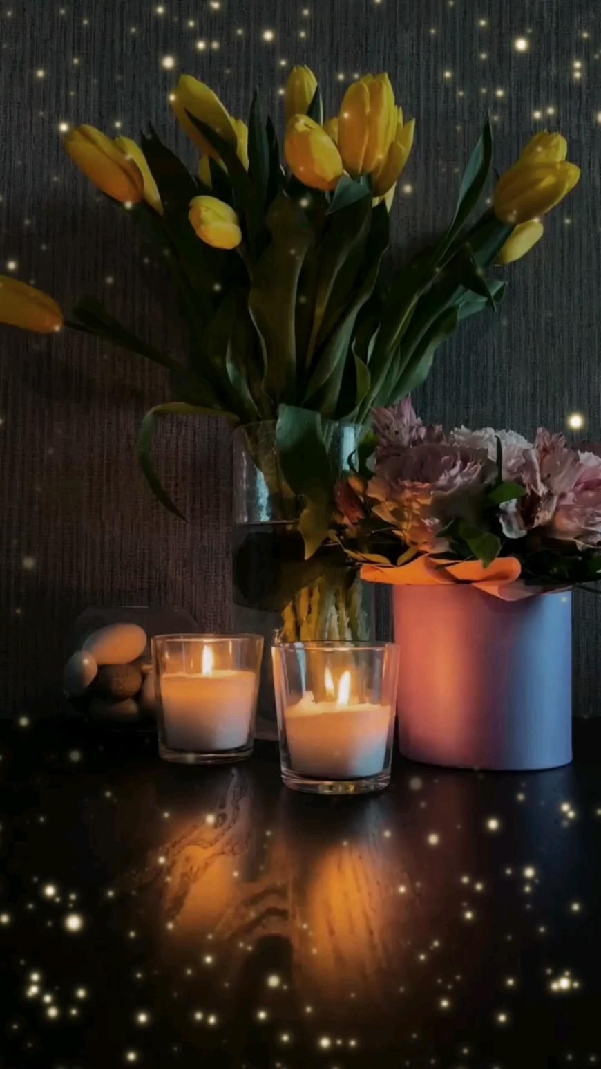 Открытка добрый вечер. добрый вечер two vases filled with flowers and lit candles on top of a wooden table in front of a wall
