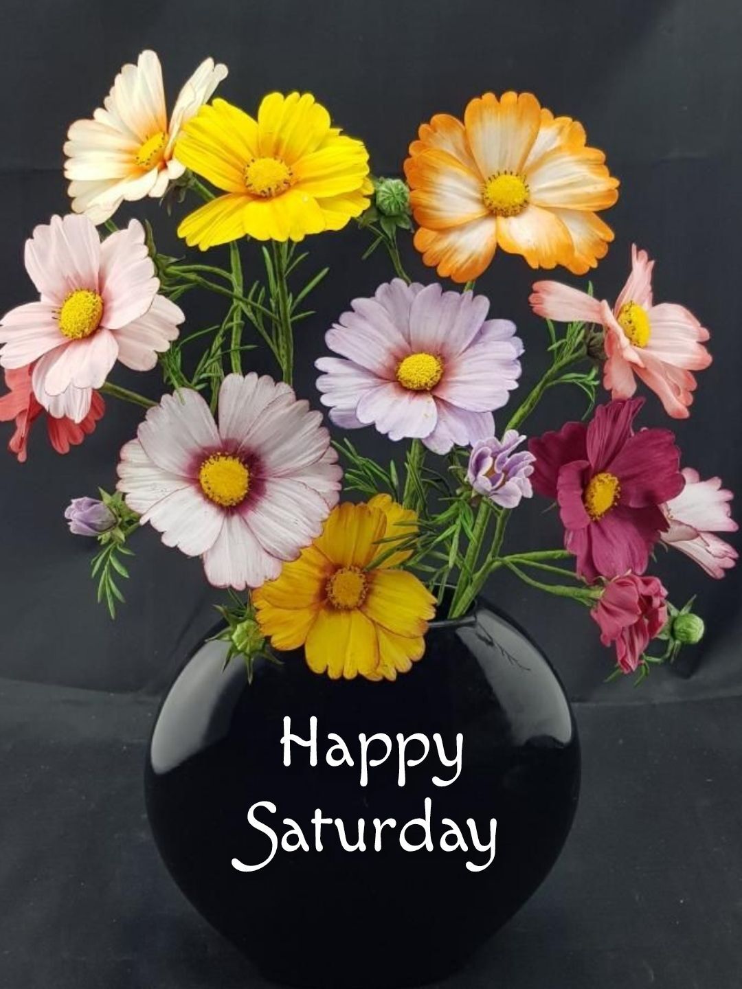 Открытка на субботу. Happy Saturday Happy Saturday a vase filled with lots of colorful flowers on top of a black table next to a sign that says happy saturday